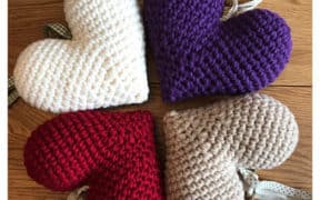 four knitted hearts