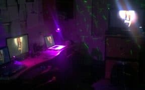 dorm room with lights and tvs