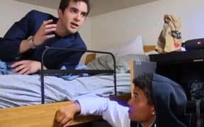 two guys talking on bunk bed