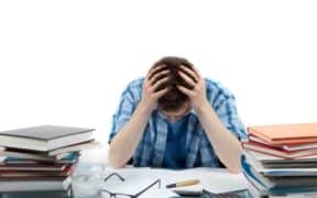 student holding head stressed