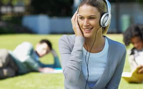 Female student listening to headphones