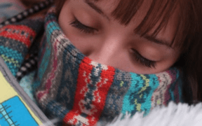 Sick Female with scarf around face
