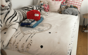 White Dorm Bed with Stuffed Animals